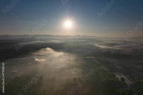 Sun light on blue sky with fog on ground. Sky background concept.