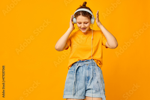 portrait of a young woman summer style headphones dance isolated backgrounds unaltered
