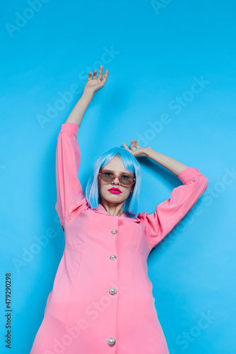 glamorous woman in sunglasses wears a blue wig makeup Lifestyle posing