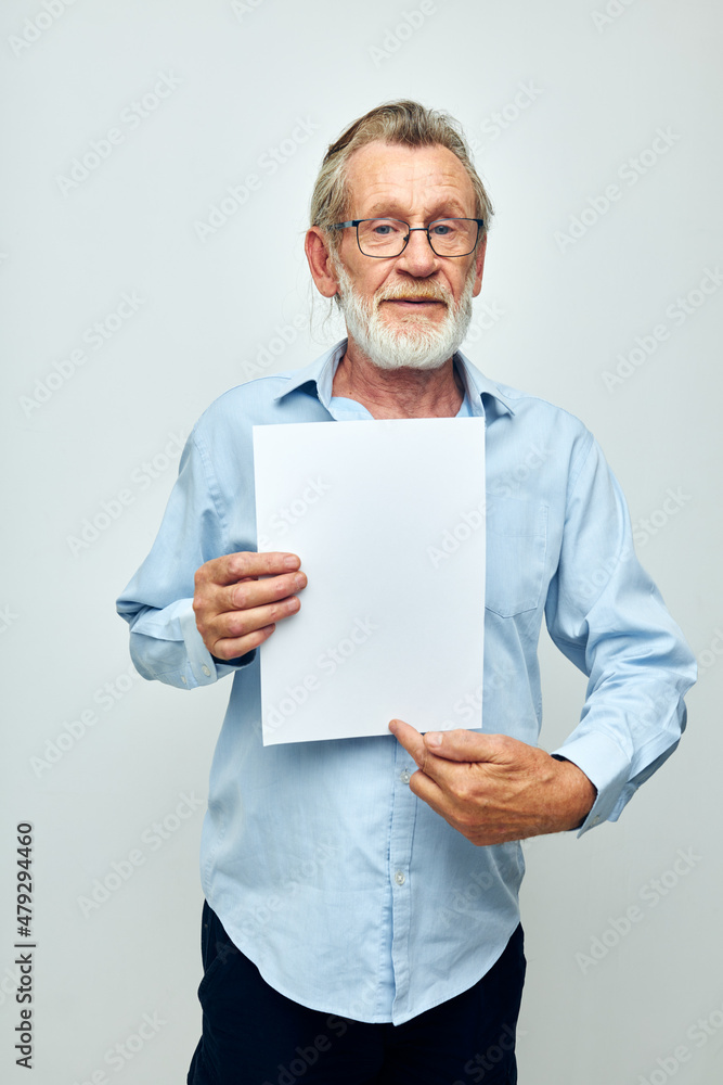 Portrait of happy senior man blank sheet of paper gesture hands smile cropped view Portrait of happy senior man blank sheet of paper gesture hands smile cropped view