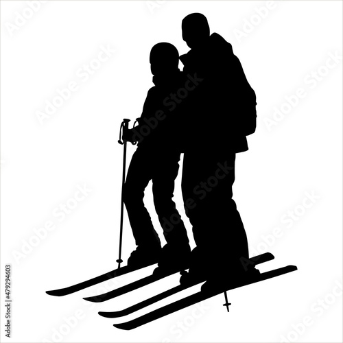 Man, woman - skiers. A guy, girl in a ski suit with ski sticks in their hands, skis on their feet. Skier stands half sideways, knees bent. Winter sports. Black silhouette isolated on white background.