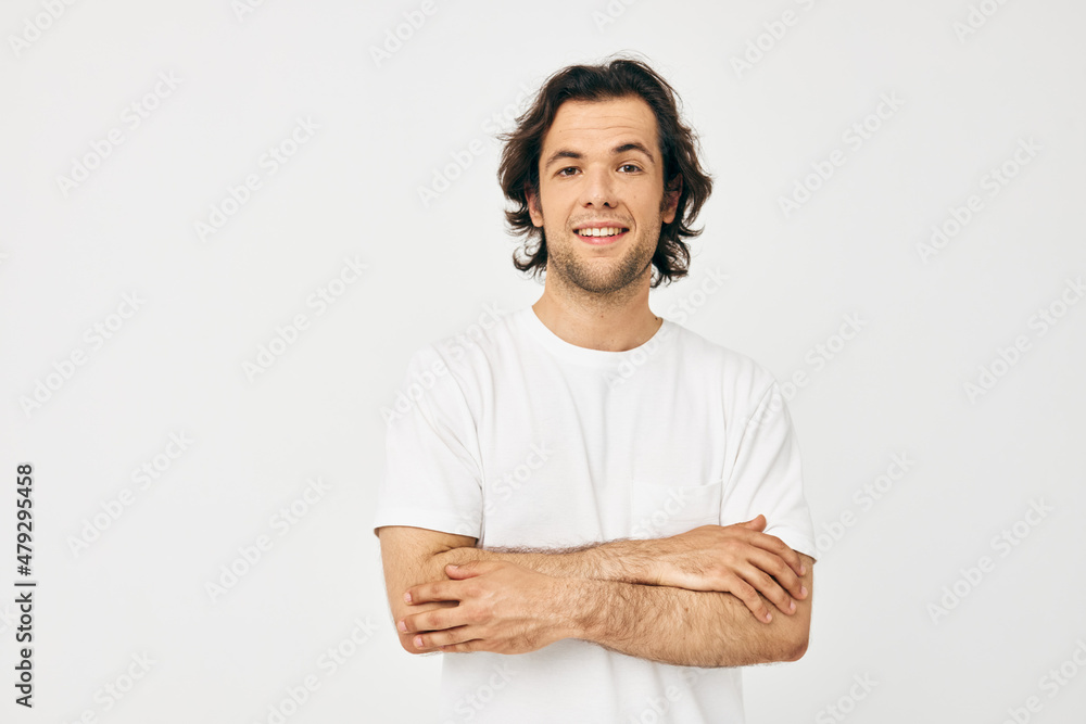Fototapeta premium handsome man in white t-shirt fashion cropped view light background