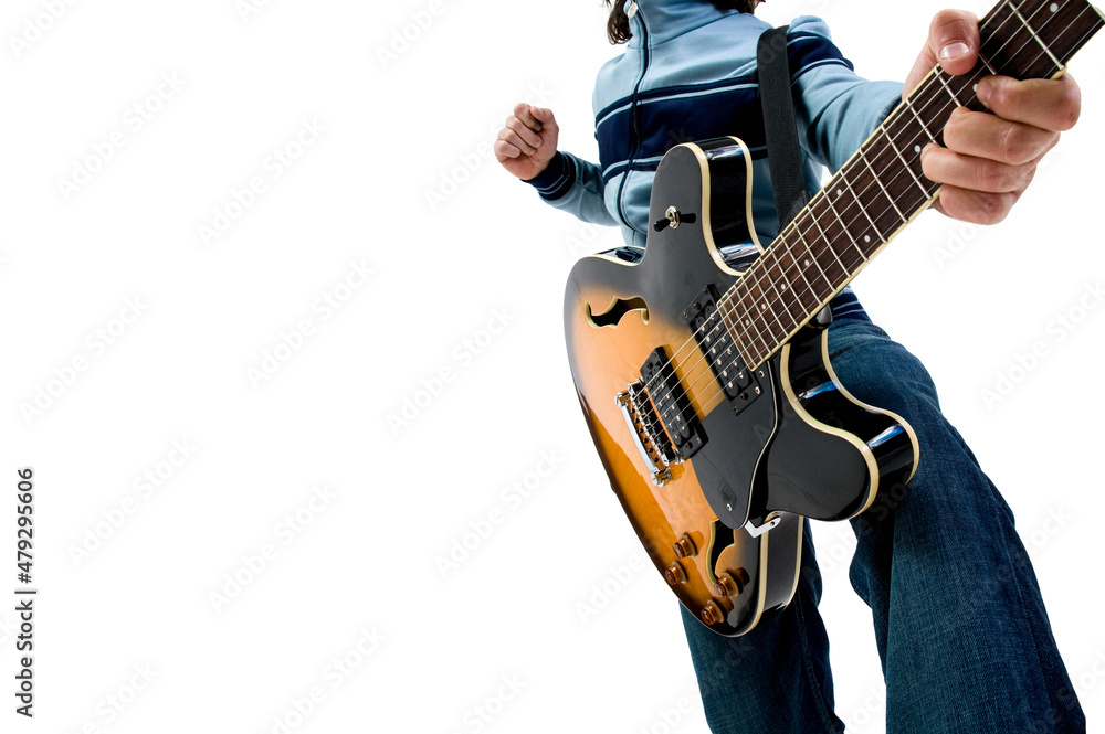 Obraz premium Boy playing electric guitar. White background with space for text.