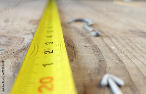фотографія Measuring tape on wooden table