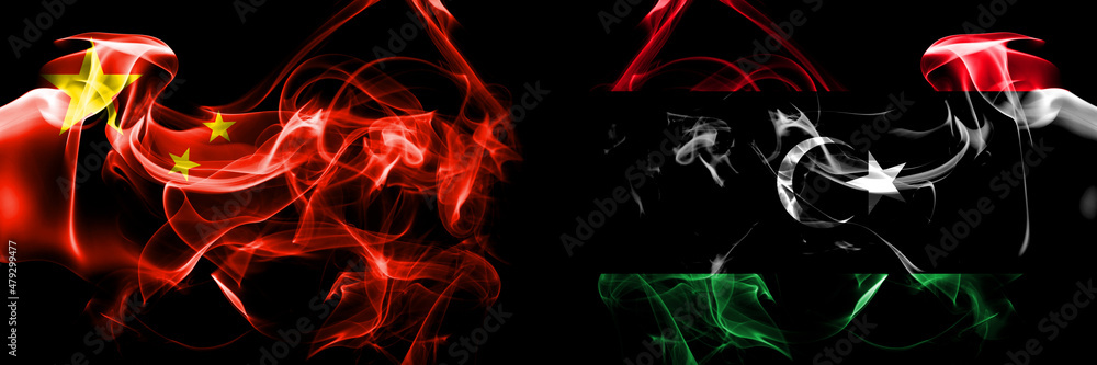 Flags of China, Chinese vs Libya, Libyan. Smoke flag placed side by side on black background. Flags of China, Chinese vs Libya, Libyan. Smoke flag placed side by side on black background.