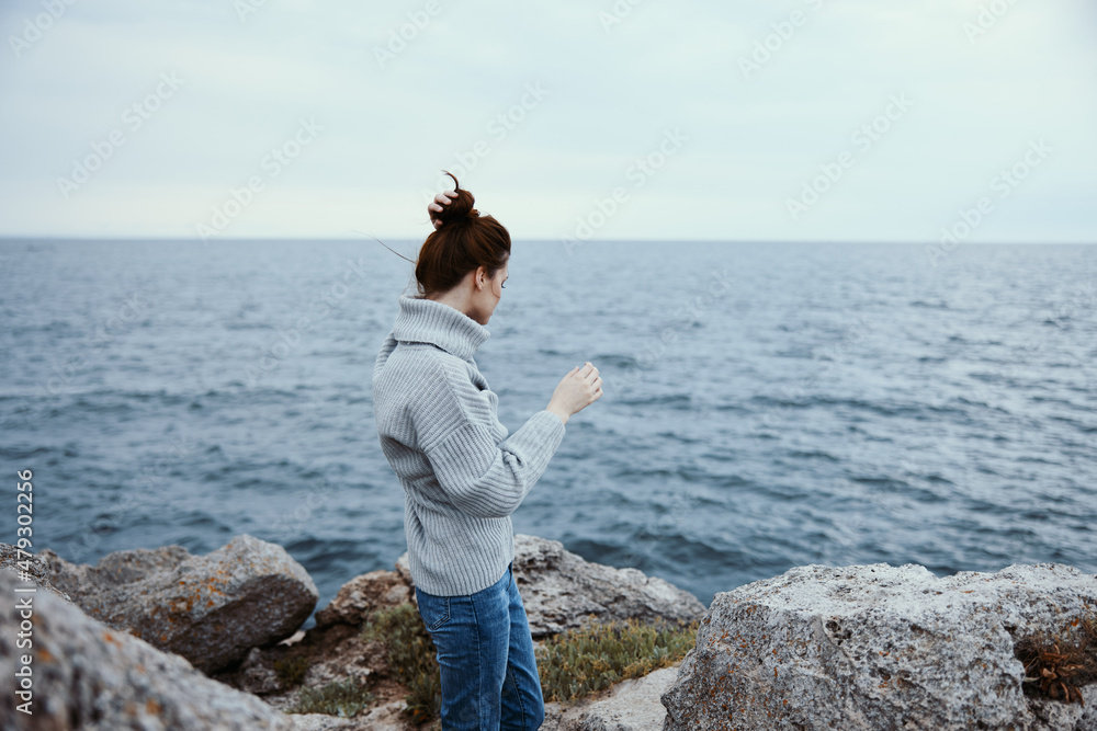 portrait of a woman freedom walk on the stone coast Relaxation concept