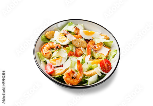 Fresh Shrimp Caesar Salad with parmesan cheese and Croutons. Isolated on white background