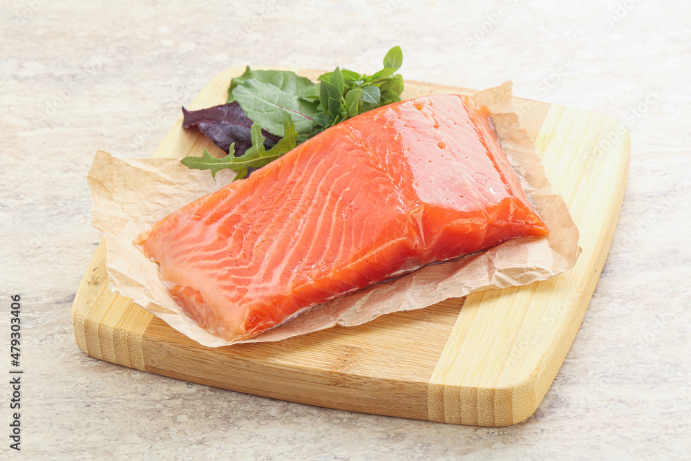 Raw salmon fillet over board Raw salmon fillet over board