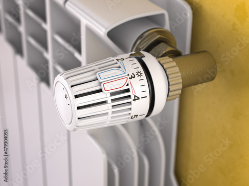 Thermostatic radiator valve close up. Temperature control and consumption saving photo