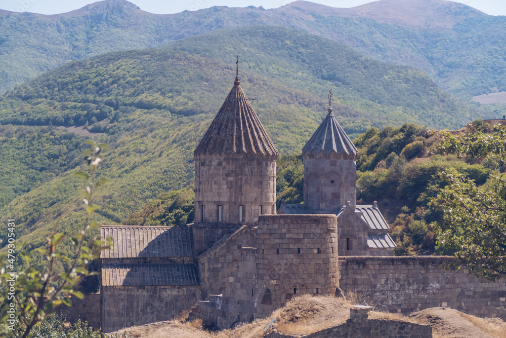 Scenic Tatev monastery view in Armenia. Ancient church ruins. Armenian landscape of Tatev monastery complex surrounded by green mountains and lush green hills stock photography