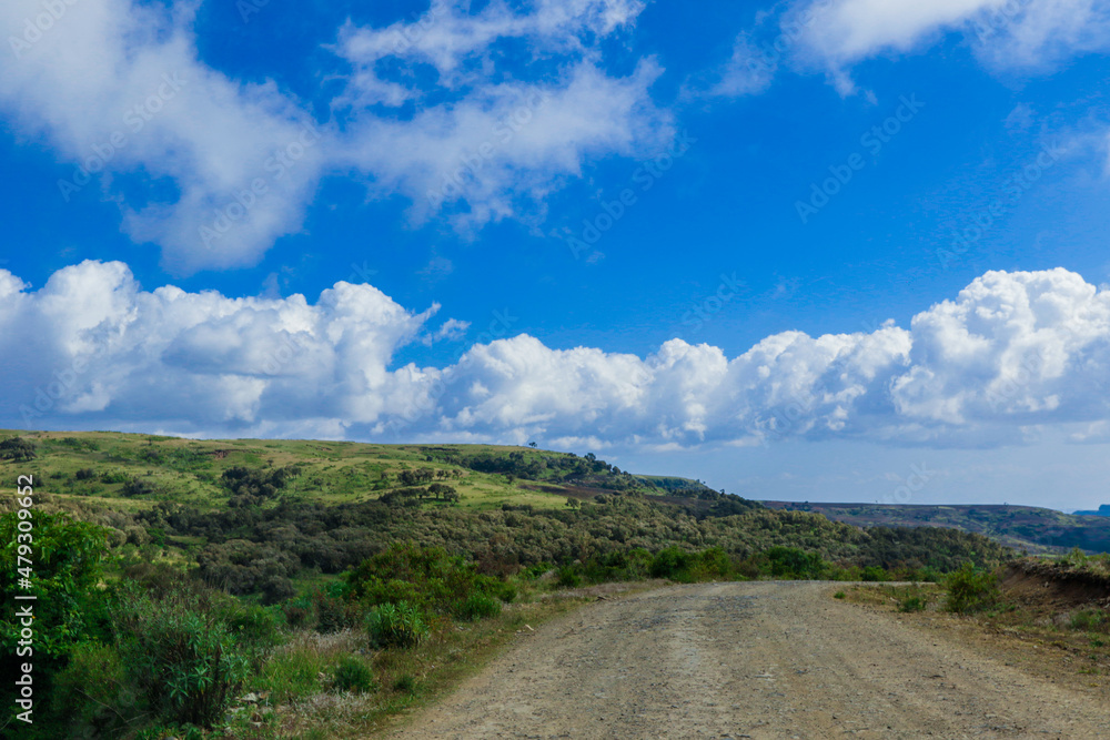 Panoramic View to the Simien Mountains in the Clouds from the Gondar Road, Northern Ethiopia Panoramic View to the Simien Mountains in the Clouds from the Gondar Road, Northern Ethiopia