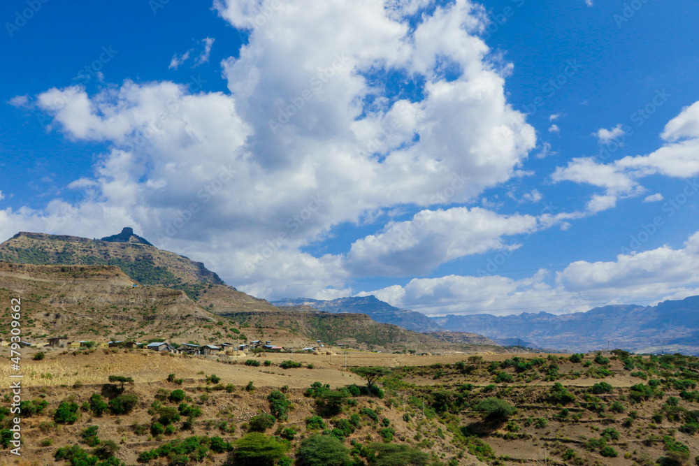 Panoramic View to the Simien Mountains in the Clouds from the Gondar Road, Northern Ethiopia Panoramic View to the Simien Mountains in the Clouds from the Gondar Road, Northern Ethiopia