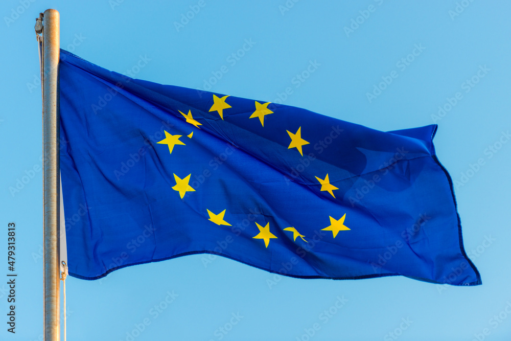 European union flag against blue sky European union flag against blue sky