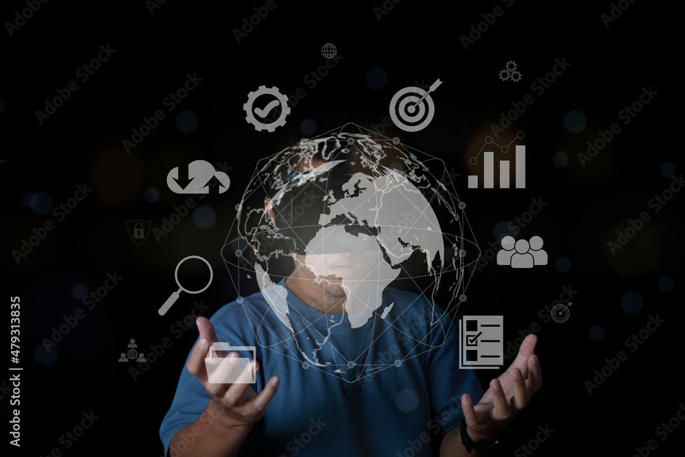 Man wearing VR glasses accessing Cloud Computing and Working with