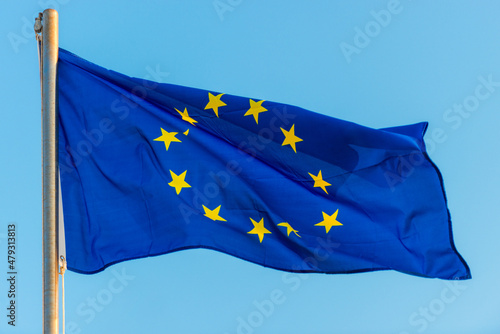 European union flag against blue sky