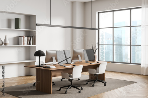 Corner view on bright office room interior with panoramic window © ImageFlow