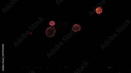4K. loop seamless of real fireworks background. abstract blur of real golden shining fireworks with bokeh lights in the night sky. glowing fireworks show. New year's eve fireworks celebration