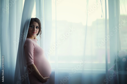 Beautiful pregnant girl with a big belly. Young married pregnant couple. Husband with a pregnant wife. A couple awaiting the birth of a baby. Free Download Beautiful pregnant girl with a big belly. Young married pregnant couple. Husband with a pregnant wife. A couple awaiting the birth of a baby. - GFXLoad