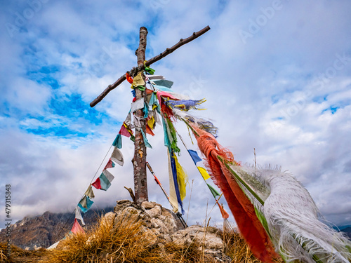 Wood cross on a mountain peak photo