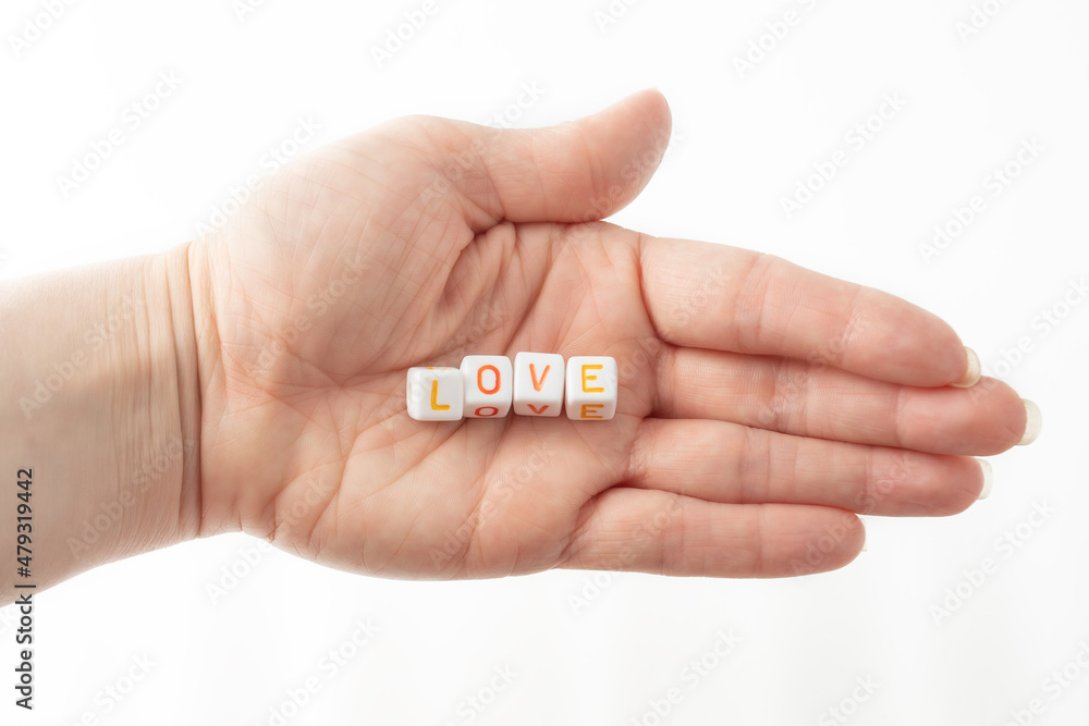 love concept word from cubes in human hand love concept word from cubes in human hand