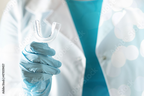 mouth guard,mouth protection dental device in the hands of a dentist