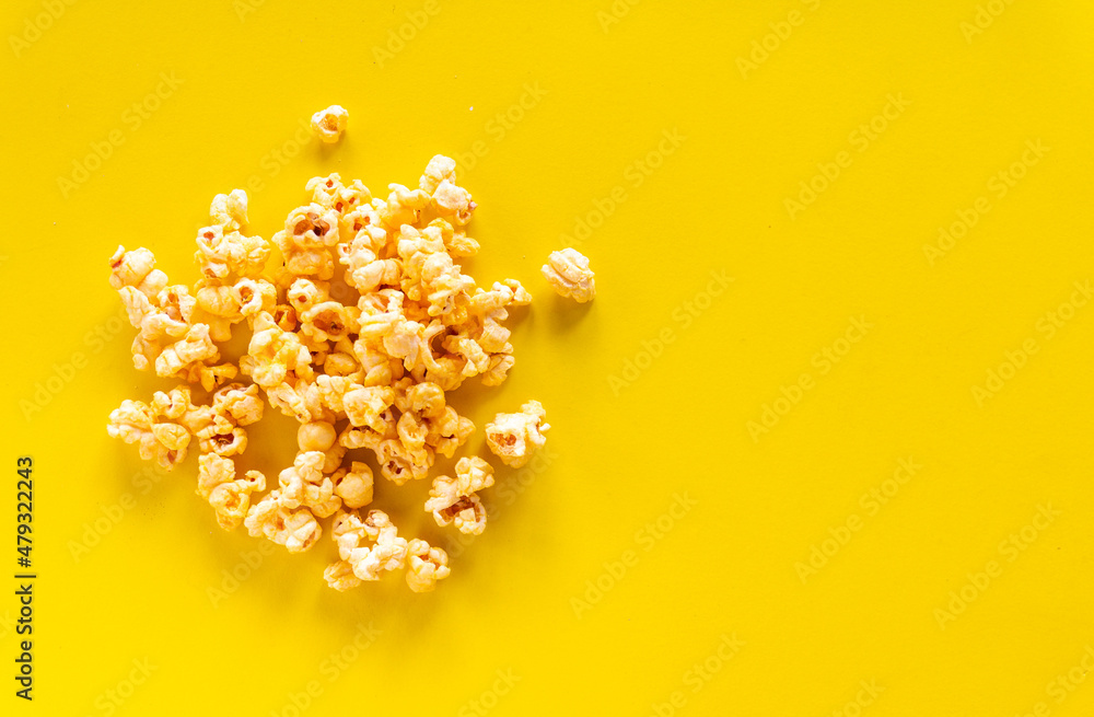 Popcorn on yellow background with copy space Popcorn on yellow background with copy space