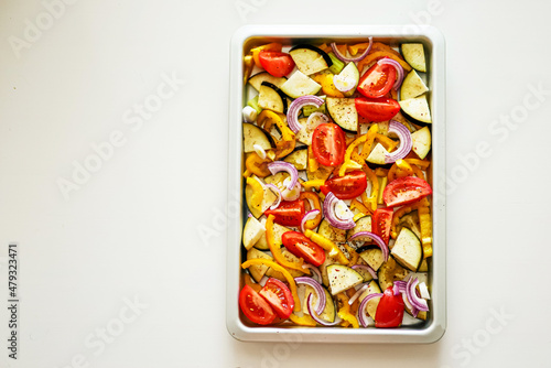 Oven Baking Vegetables, Peppers, Zucchini, Tomatoes on a Baking Tray, Sheet Pan Vegetables Background