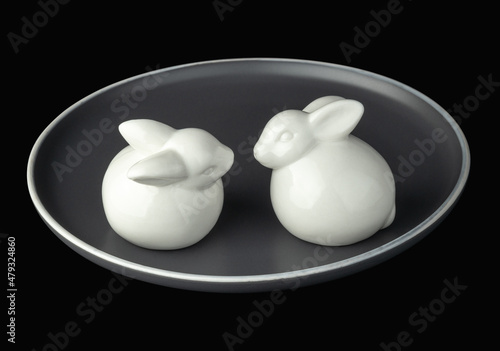 White easter bunnies on a gray plate