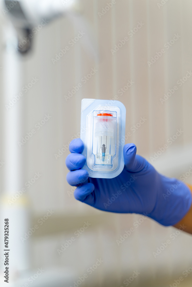 Close up view of sterile equipment holding in hands. Medical professional healthcare treatment.