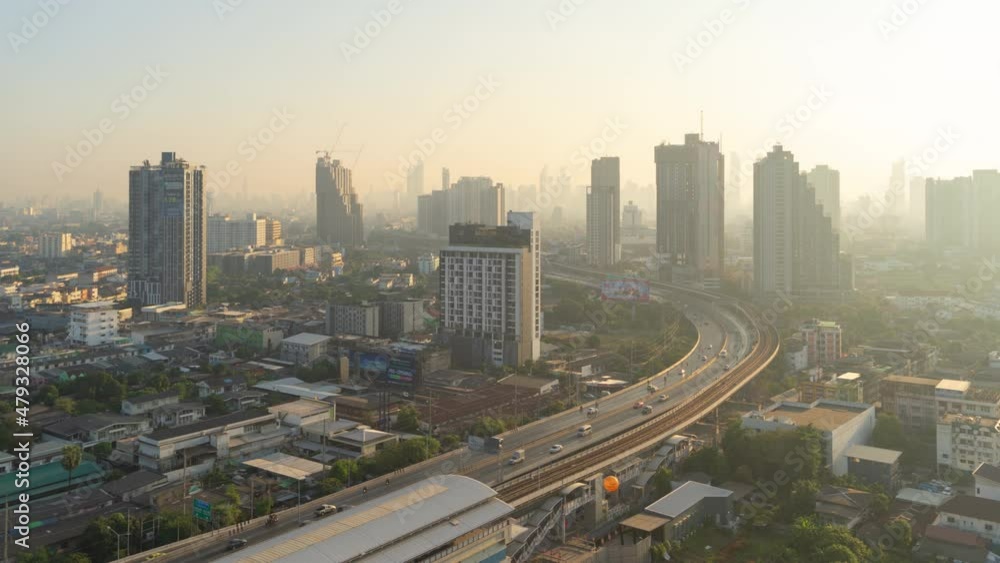 Time lapse of aerial view of highway street road at Bangkok Downtown Skyline, Thailand. Financial district and business centers in smart urban city in Asia.Skyscraper and high-rise buildings at sunset Time lapse of aerial view of highway street road at Bangkok Downtown Skyline, Thailand. Financial district and business centers in smart urban city in Asia.Skyscraper and high-rise buildings at sunset