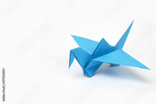 Origami paper crane flying 