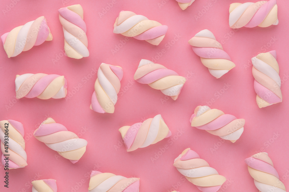 Colorful marshmallow laid out on pastel background. Creative textured pattern. Colorful marshmallow laid out on pastel background. Creative textured pattern.