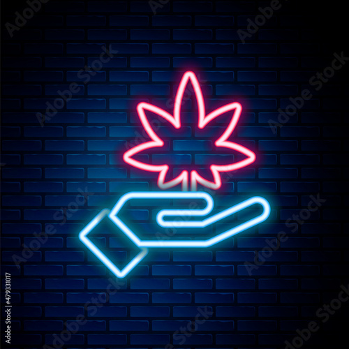 Glowing neon line Medical marijuana or cannabis leaf icon isolated on brick wall background. Hemp symbol. Colorful outline concept. Vector