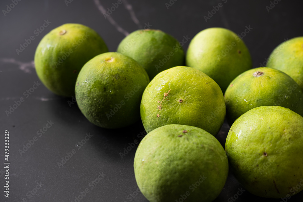 Group of lime Fruits with dark background Group of lime Fruits with dark background