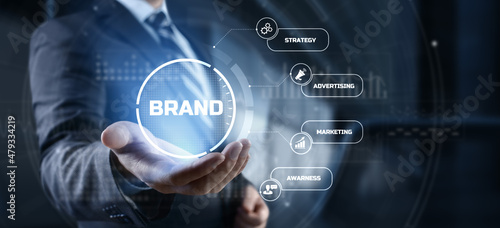 Brand development marketing strategy concept. Businessman pressing button on screen. photo