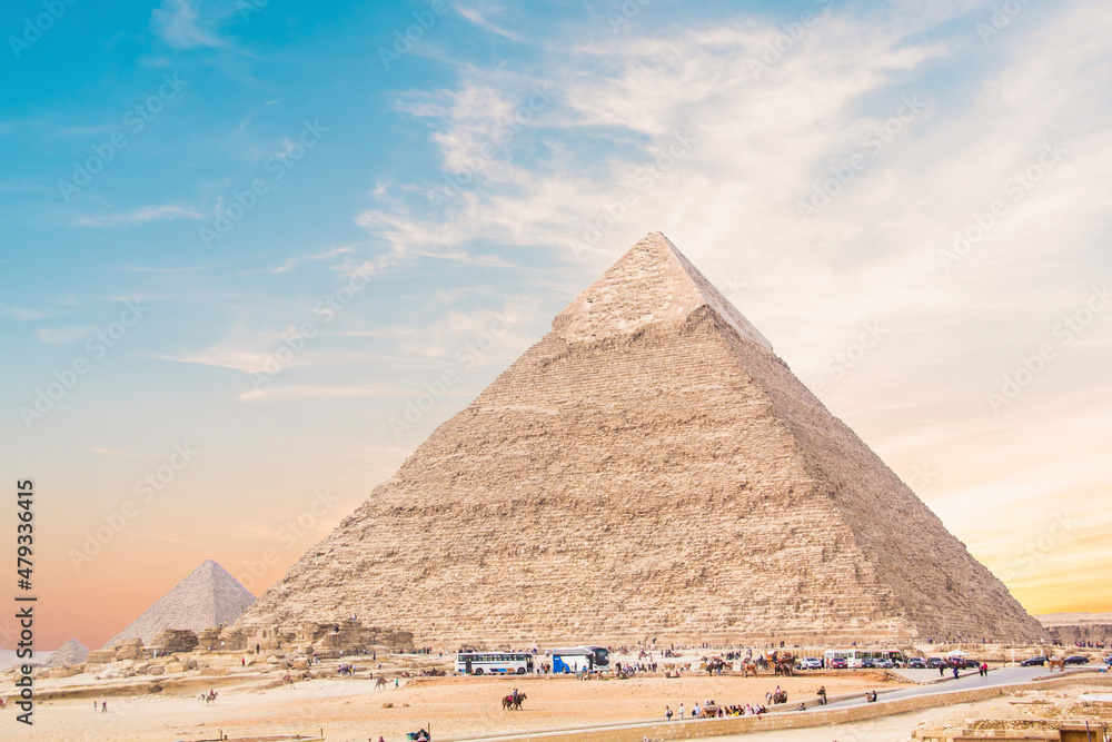 Great Sphinx against the background of the pyramids of the pharaohs Cheops, Khafren, and Mikerin in Giza, Egypt