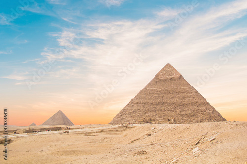 Great Sphinx against the background of the pyramids of the pharaohs Cheops  Khafren  and Mikerin in Giza  Egypt