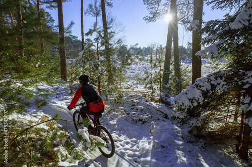Person riding mtb in snow photo
