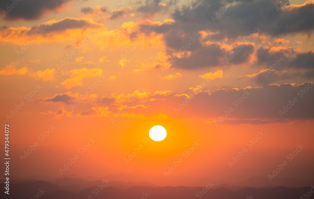 beautiful nature landscape scene background. closeup the sun at sunset with cloud at outdoor mountain in vacation time.