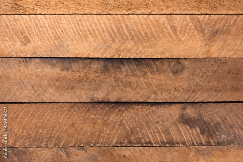 surface of rough bare wood planks, unfinished lumber boards background texture for designing, empty full frame taken from above, top down view