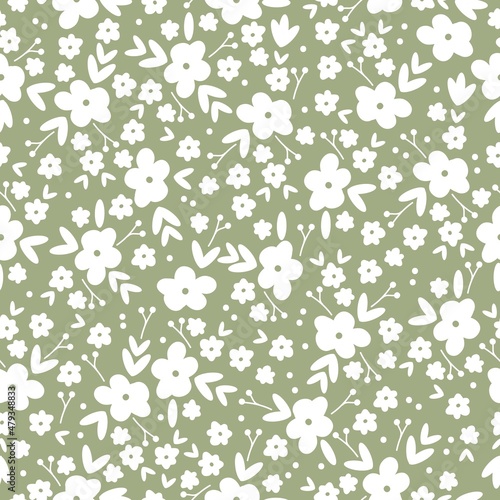 Beautiful vintage pattern. White flowers and leaves . Green background. Floral seamless background. An elegant template for fashionable prints.