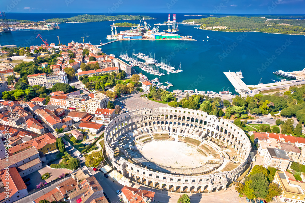 Arena Pula. Ancient ruins of Roman amphitheatre and Pula waterfront aerial view
