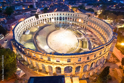 Arena Pula. Ancient ruins of Roman amphitheatre in Pula aerial evening view