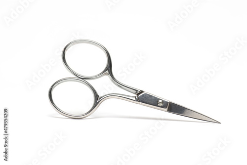 closeup pointed sharp metal scissors white background