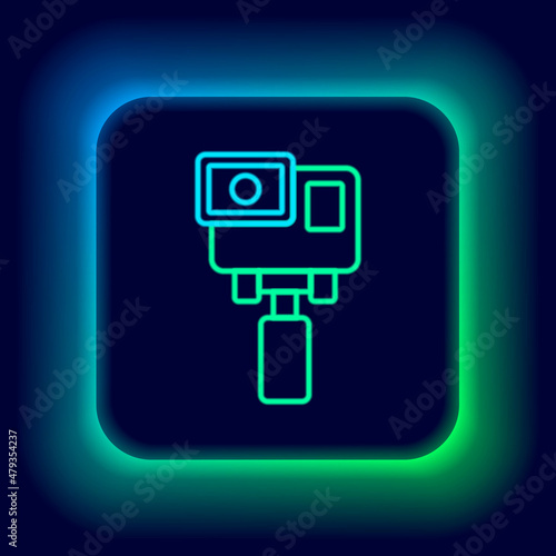 Glowing neon line Action extreme camera icon isolated on black background. Video camera equipment for filming extreme sports. Colorful outline concept. Vector