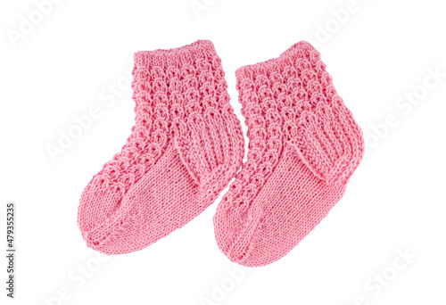 Small knitted pink socks on a white background.