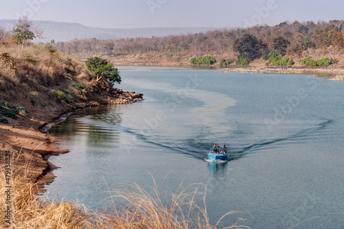 Boating at beautiful Panna river at Panna National Park, Madhya Pradesh, India. It is located in Panna and Chhatarpur districts of Madhya Pradesh in India. A tiger reserve. photo