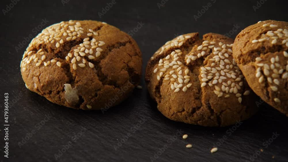 Close-up of three fresh oatmeal cookies with sesame sprinkles Close-up of three fresh oatmeal cookies with sesame sprinkles