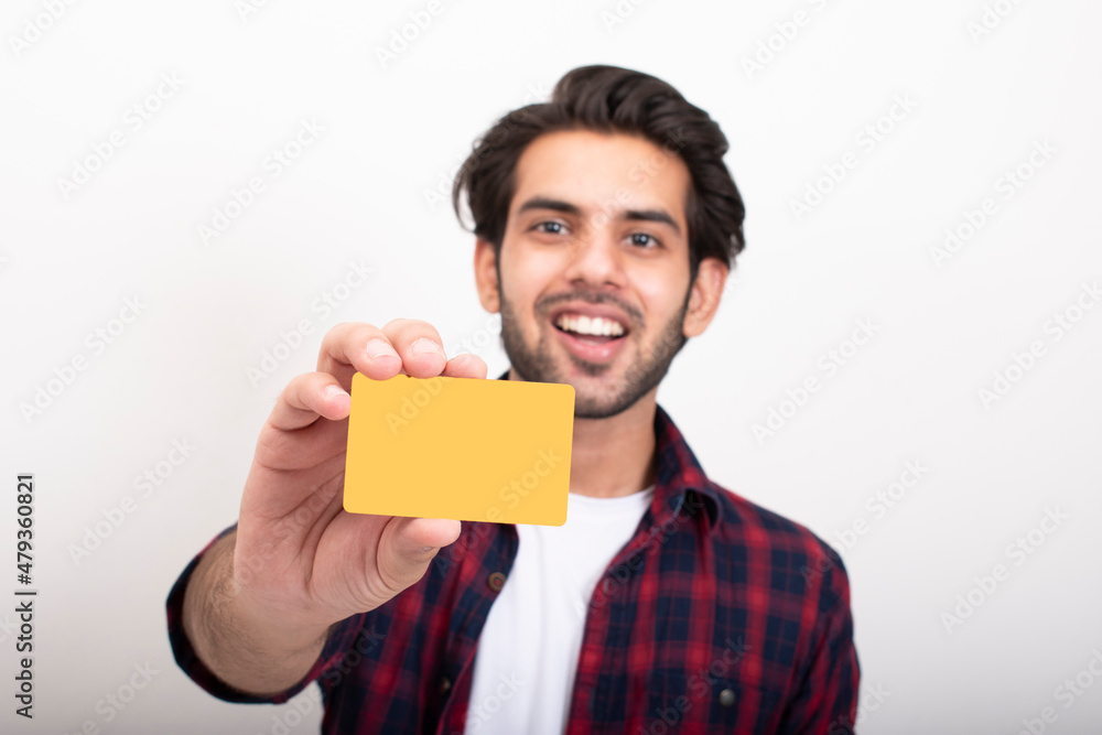 Young Man showing credit card Young Man showing credit card