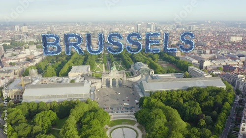 Inscription on video. Brussels, Belgium. Park of the Fiftieth Anniversary. Park Senkantoner. The Arc de Triomphe of Brussels (Brussels Gate). Blue lights form luminous. Electric style, Aerial View photo